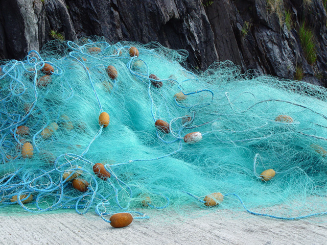 Image of fishing net with floats placed on the floor