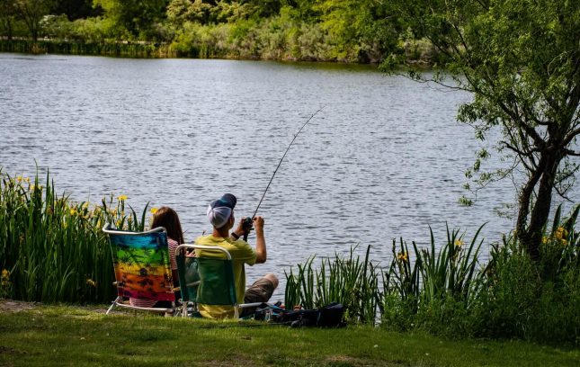 A Couple fishing in a beautiful lake