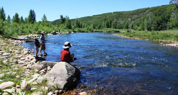 Image Showing group of persons fishing on a lake