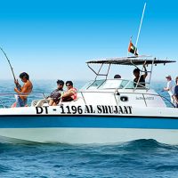 Group of Tourist fishing from an electric boat on the sea