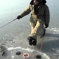 A man trying to catch smelts