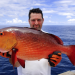 A fisherman showing his catched redsnapper