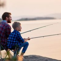 A Father & Son Getting Relaxed While Fishing.