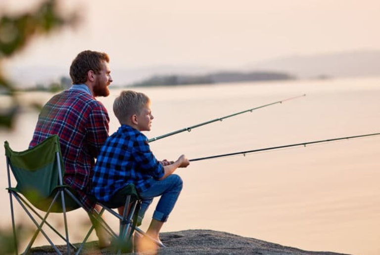 A Father & Son Getting Relaxed While Fishing.