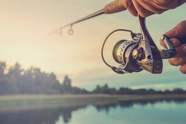 Fishing Rod Wheel Closeup - A Fisher Man Holding That.