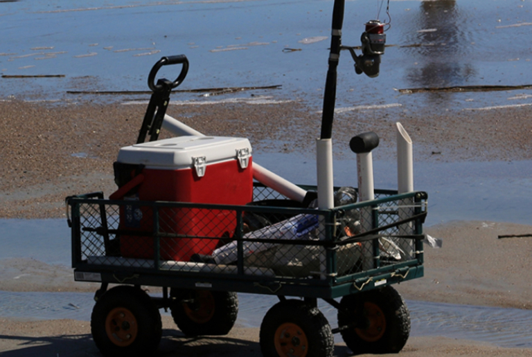 A Cart With Fishing Supplies Is Ready For A Fisherman's Use.